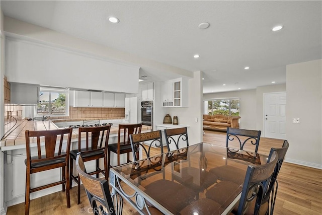 8558 W W Ave E8, Lancaster, CA 93536 - dining area with light wood-type flooring and recessed lighting