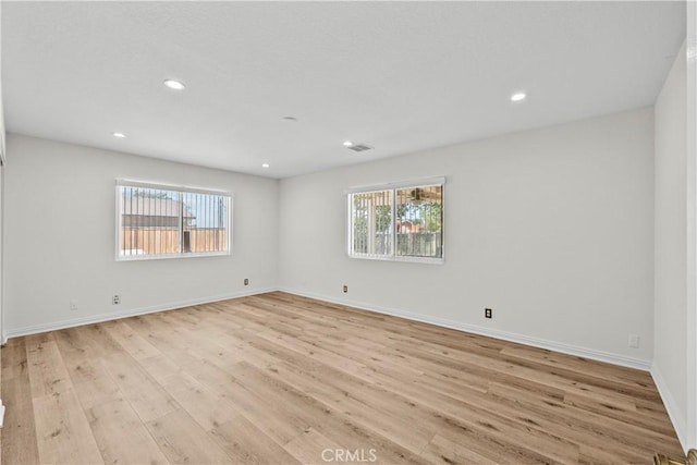 8558 W W Ave E8, Lancaster, CA 93536 - empty room featuring light wood-type flooring and recessed lighting