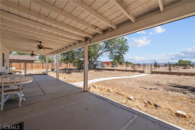 8558 W W Ave E8, Lancaster, CA 93536 - fenced backyard with ceiling fan and a patio area