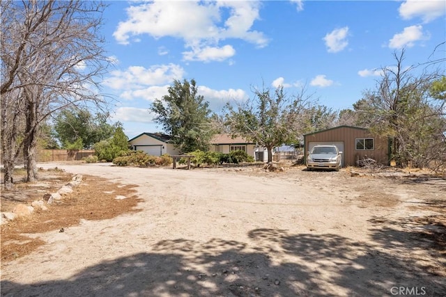 8558 W W Ave E8, Lancaster, CA 93536 - view of yard featuring a detached garage