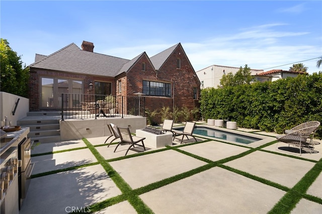 4730 Angeles Vista Blvd, View Park, CA 90043 - view of patio with an outdoor fire pit and an outdoor pool