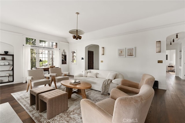 4730 Angeles Vista Blvd, View Park, CA 90043 - living area featuring arched walkways and dark wood-type flooring