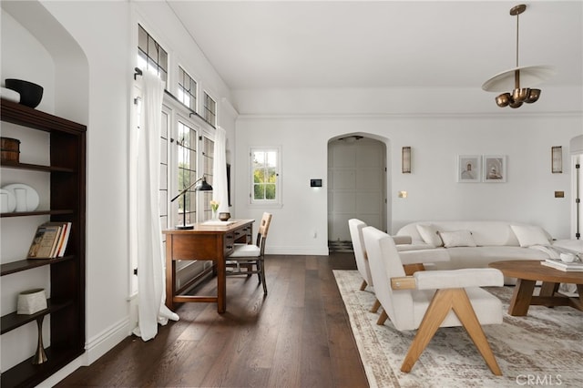 4730 Angeles Vista Blvd, View Park, CA 90043 - living room with arched walkways and dark wood-type flooring