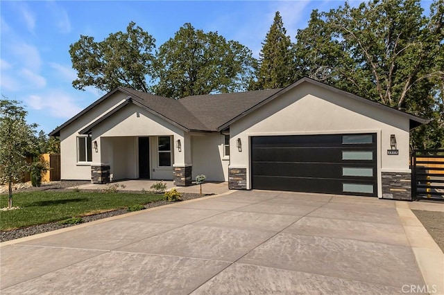5909 Del Mar Ave, Paradise, CA 95969 - view of front of house featuring stone siding, stucco siding, a garage, and driveway