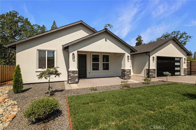 5909 Del Mar Ave, Paradise, CA 95969 - view of front facade with stucco siding, stone siding, an attached garage, and driveway