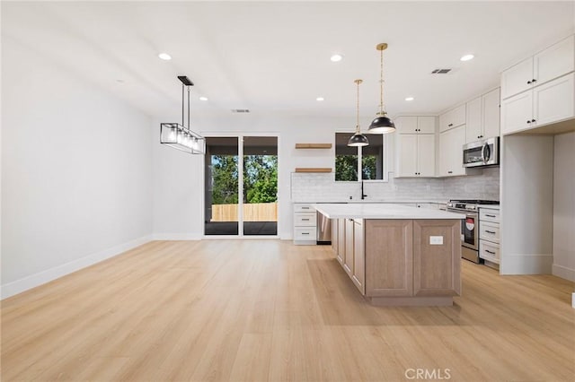 5909 Del Mar Ave, Paradise, CA 95969 - kitchen with appliances with stainless steel finishes, open shelves, light wood-type flooring, decorative backsplash, and recessed lighting