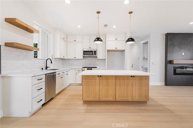 5909 Del Mar Ave, Paradise, CA 95969 - kitchen featuring stainless steel appliances, open shelves, a center island, light countertops, and recessed lighting