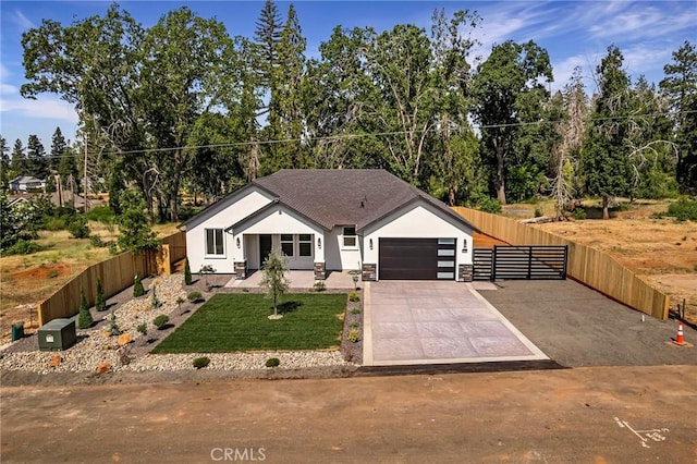 5909 Del Mar Ave, Paradise, CA 95969 - view of front facade with stucco siding, a garage, and driveway