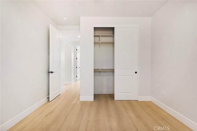 5909 Del Mar Ave, Paradise, CA 95969 - unfurnished bedroom with light wood-style flooring and a closet