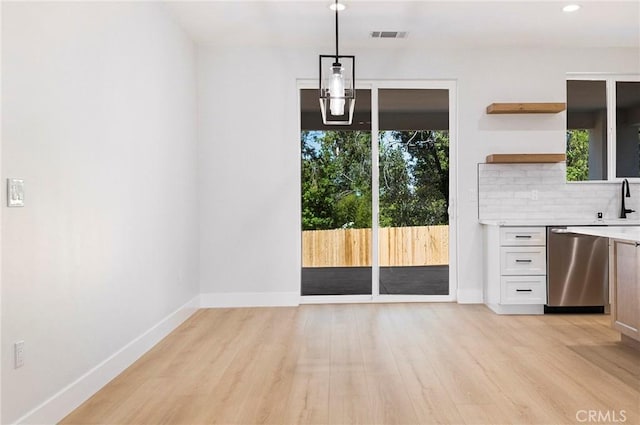 5909 Del Mar Ave, Paradise, CA 95969 - unfurnished dining area featuring light wood-style floors and recessed lighting