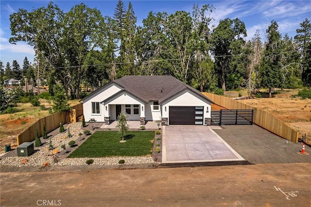 5909 Del Mar Ave, Paradise, CA 95969 - view of front of home with stucco siding, a garage, and driveway