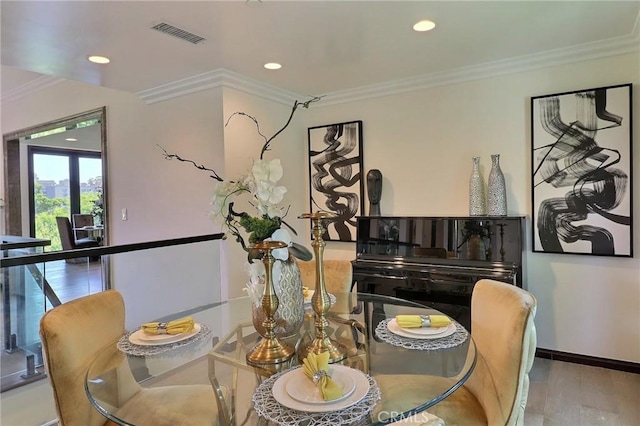 182 Denslow Ave, Los Angeles, CA 90049 - dining area featuring wood finished floors, crown molding, and recessed lighting