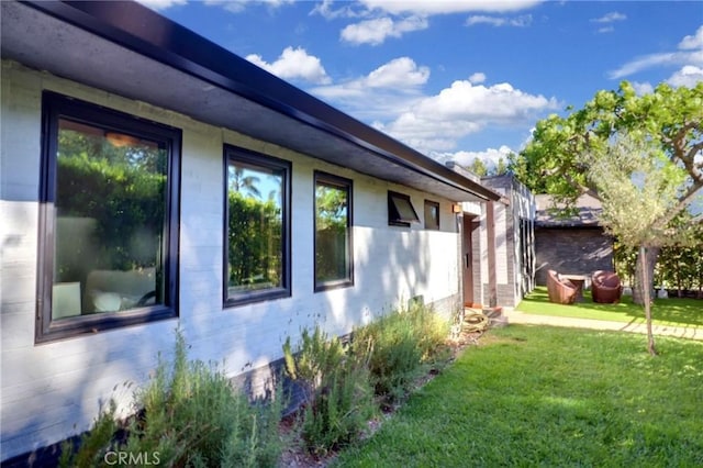 182 Denslow Ave, Los Angeles, CA 90049 - view of home's exterior featuring a lawn