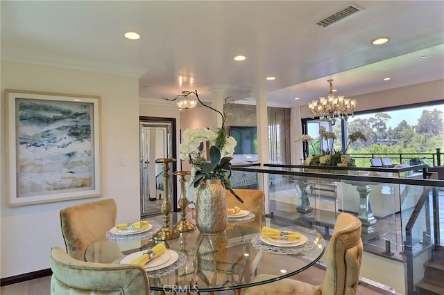 182 Denslow Ave, Los Angeles, CA 90049 - dining area with a chandelier, recessed lighting, ornamental molding, and ornate columns
