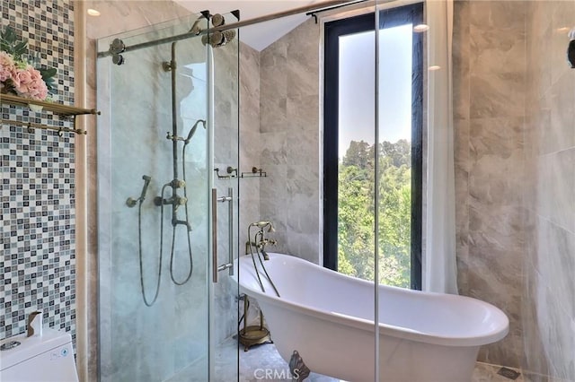 182 Denslow Ave, Los Angeles, CA 90049 - bathroom with tile walls, a shower stall, and a freestanding bath