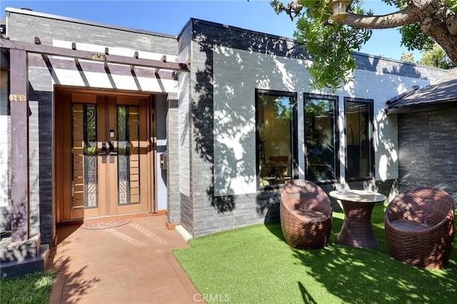 182 Denslow Ave, Los Angeles, CA 90049 - doorway to property featuring french doors and brick siding