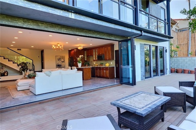 182 Denslow Ave, Los Angeles, CA 90049 - view of patio with an outdoor hangout area and a wooden deck