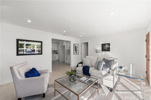 611 Griffith St, San Fernando, CA 91340 - living room featuring light wood-style floors and recessed lighting