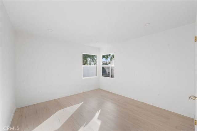 611 Griffith St, San Fernando, CA 91340 - spare room with light wood-style flooring and baseboards