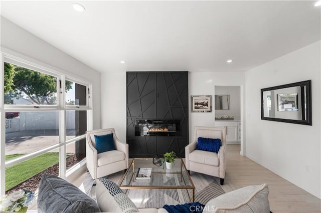 611 Griffith St, San Fernando, CA 91340 - living room featuring light wood-type flooring, a large fireplace, and recessed lighting
