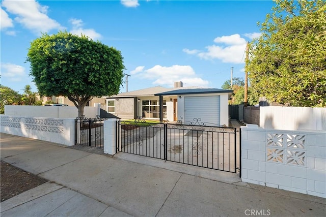 611 Griffith St, San Fernando, CA 91340 - single story home with a fenced front yard, a garage, a gate, and concrete driveway