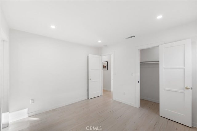 611 Griffith St, San Fernando, CA 91340 - unfurnished bedroom featuring light wood finished floors, recessed lighting, and a walk in closet