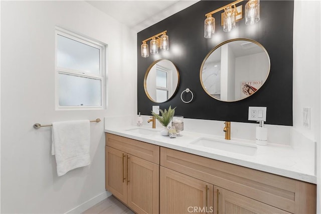 611 Griffith St, San Fernando, CA 91340 - bathroom with double vanity and baseboards
