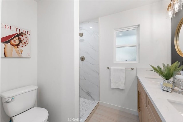 611 Griffith St, San Fernando, CA 91340 - full bathroom with double vanity, a marble finish shower, and wood finished floors