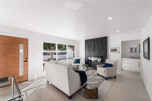 611 Griffith St, San Fernando, CA 91340 - living area with light wood-style floors and recessed lighting