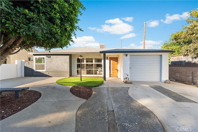 611 Griffith St, San Fernando, CA 91340 - single story home featuring stucco siding, driveway, and an attached garage