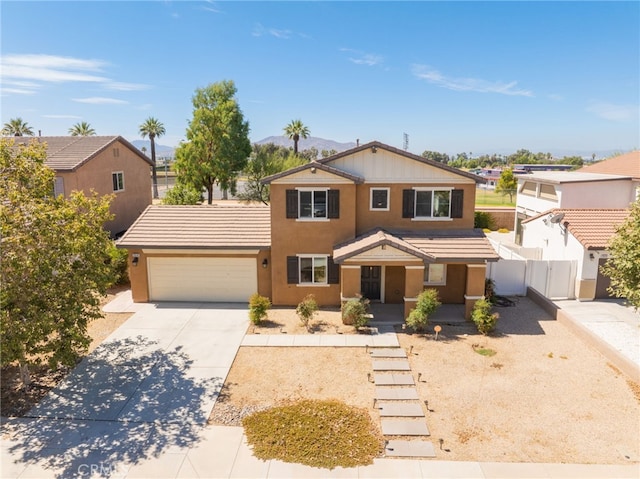26649 Azalea St, Moreno Valley, CA 92555 - traditional home with a garage, concrete driveway, stucco siding, and covered porch
