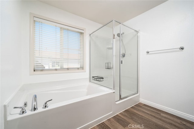 26649 Azalea St, Moreno Valley, CA 92555 - full bathroom featuring a shower stall, a bath, and wood finished floors
