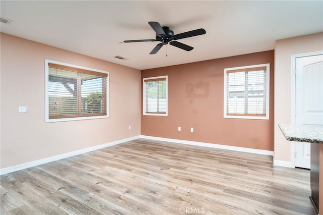 26649 Azalea St, Moreno Valley, CA 92555 - empty room with healthy amount of natural light and light wood-style flooring