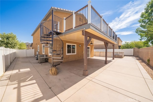 26649 Azalea St, Moreno Valley, CA 92555 - rear view of house featuring a patio, a fenced backyard, stairway, and stucco siding