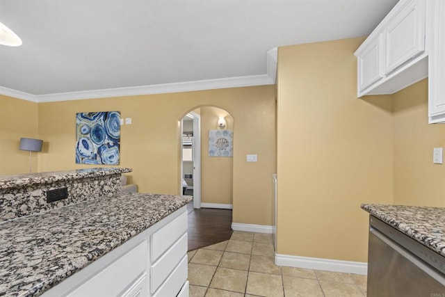 800 N Mollison Ave Unit 56, El Cajon, CA 92021 - kitchen featuring ornamental molding, arched walkways, light stone countertops, white cabinets, and light tile patterned flooring
