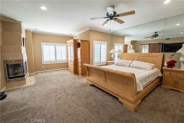 39560 Tinderbox Way, Murrieta, CA 92562 - bedroom featuring carpet floors, crown molding, recessed lighting, and a tile fireplace