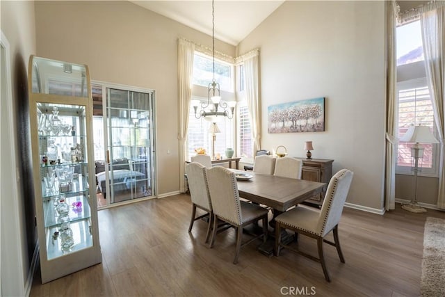 39560 Tinderbox Way, Murrieta, CA 92562 - dining space featuring wood finished floors and high vaulted ceiling