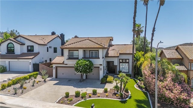 39560 Tinderbox Way, Murrieta, CA 92562 - mediterranean / spanish house with a tiled roof, an attached garage, stucco siding, and driveway