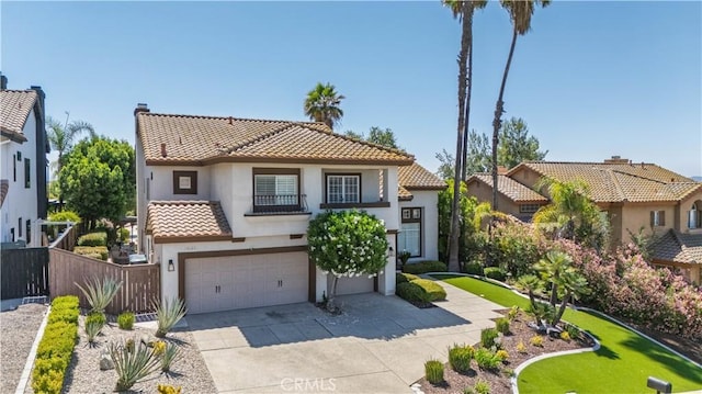 39560 Tinderbox Way, Murrieta, CA 92562 - mediterranean / spanish house featuring a tiled roof, stucco siding, an attached garage, and driveway