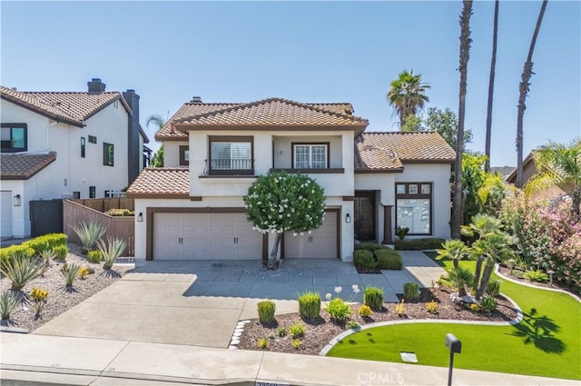 39560 Tinderbox Way, Murrieta, CA 92562 - mediterranean / spanish house with a tiled roof, stucco siding, a garage, and concrete driveway