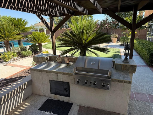 39560 Tinderbox Way, Murrieta, CA 92562 - fenced backyard with an outdoor kitchen and a patio