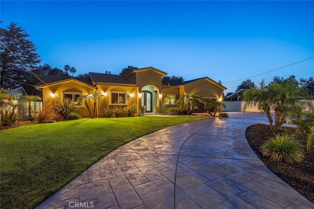 8817 Encino Ave, Sherwood Forest, CA 91325 - view of front facade with stucco siding and curved driveway