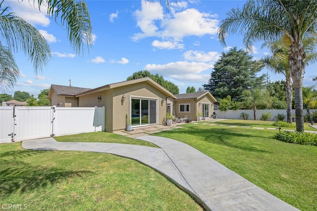 8817 Encino Ave, Sherwood Forest, CA 91325 - rear view of house with a gate and stucco siding
