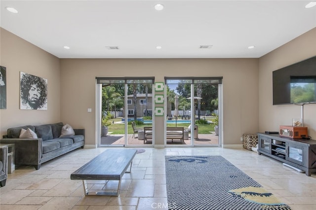 8817 Encino Ave, Sherwood Forest, CA 91325 - living area with stone tile floors, healthy amount of natural light, and recessed lighting