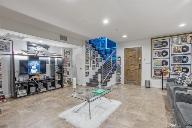 8817 Encino Ave, Sherwood Forest, CA 91325 - living room with stairway, recessed lighting, and stone finish floors