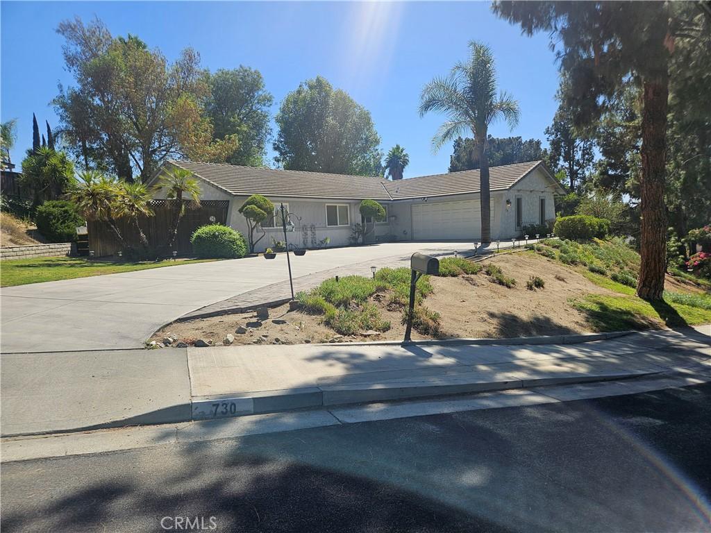 730 Via Concepcion, Riverside, CA 92506 - ranch-style house featuring concrete driveway and an attached garage