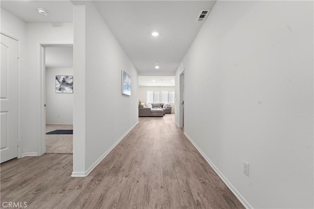10335 Saint Andrews Ct, Adelanto, CA 92301 - corridor featuring wood finished floors and recessed lighting