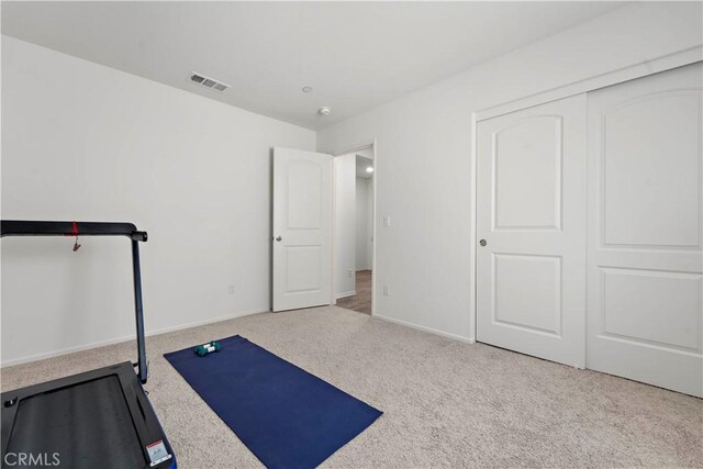 10335 Saint Andrews Ct, Adelanto, CA 92301 - exercise room with carpet and baseboards