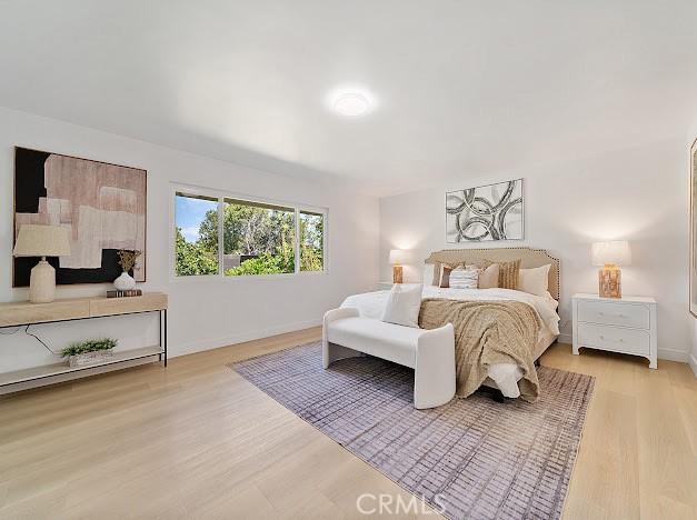 1050 Loma Verde Dr, Arcadia, CA 91006 - bedroom with light wood-type flooring and baseboards