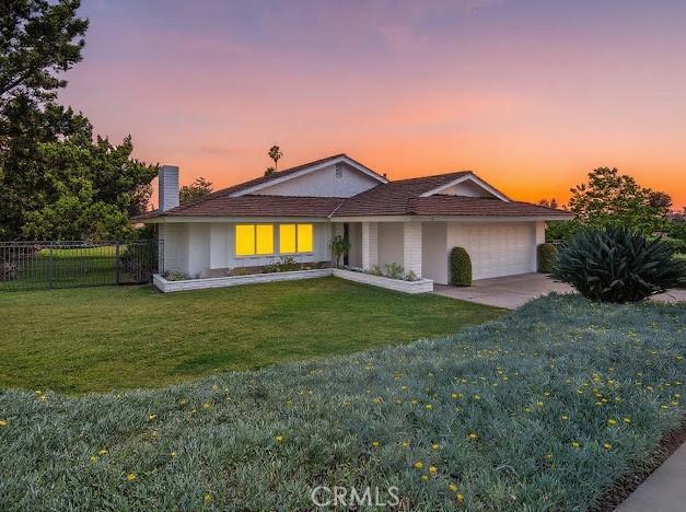1050 Loma Verde Dr, Arcadia, CA 91006 - ranch-style home with an attached garage, concrete driveway, and a chimney